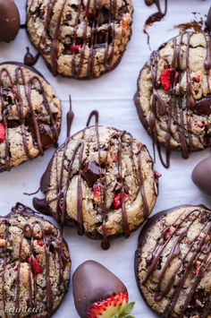 chocolate covered cookies and strawberries on a tray