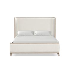 a bed with white linens and pillows on top of the headboard, in front of a white background