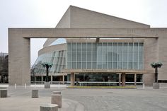 a large brick building with an arch in the middle of it's front entrance