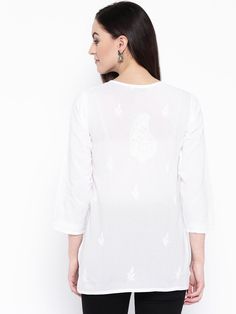 "Find more items of ADA:- https://www.etsy.com/in-en/shop/AdachikanStudio SKU: A100237 Fabric: Cotton Length: 34 inches Neck: Round Neck Sleeves: Three-Quarter Sleeves Color: White Embroidery: UltiBakhiya , Phanda , and Ghaspatti Thread: White Cotton Touch and Feel: Soft and Comfortable MADE IN INDIA breathable and comfortable summer wear cotton Silhouette: White cotton hand embroidered Lucknowi Chikankari top which is bedecked with White cotton needle work. Disclaimer: This product is hand embr Casual Blouse With Chikankari Embroidery For Festive Occasions, Casual Festive Blouse With Chikankari Embroidery, Bohemian Straight Kurta Tops For Navratri, Traditional V-neck Top With Chikankari Embroidery, Cotton Chikankari Embroidered V-neck Top, Cotton V-neck Blouse With Chikankari Embroidery, Cotton V-neck Top With Chikankari Embroidery, V-neck Cotton Kurta With Resham Embroidery, Self Design Cotton Tops For Summer