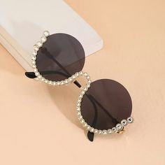 Introducing Rhinestone Round Diamond Sunglasses Elevate your style game with our Rhinestone Round Diamond Sunglasses, the epitome of luxury fashion eyewear. Designed to turn heads and make a statement, these sunglasses are a must-have accessory for every fashionable woman. Product Features: Round, diamond, and oval sunglasses styles Exquisite rhinestone detailing Constructed with high-quality alloy frame material Polycarbonate lenses for durability Gradient and UV400 lenses optical attributes for eye protection Suitable for various face shapes Benefits: Elevates any outfit with a touch of luxury and glamour Provides eye protection against harmful UV rays Durable construction ensures long-lasting wear Complements different face shapes for a flattering look Perfect for daily wear, driving, s Diamond Sunglasses, Fashion Eyewear, Oval Sunglasses, Eyewear Fashion, Eye Protection, Mens Slippers, Memorable Gifts, Beach Trip, Mens Casual Shoes