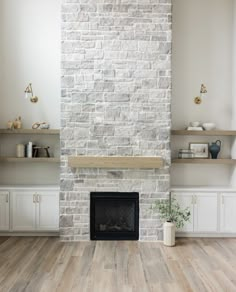 a white brick fireplace in a living room