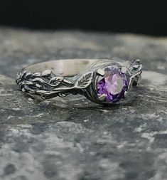 Introducing the enchanting Amethyst Stone Silver Ring by RedFoxSilverCrafts! 🌹✨ Immerse yourself in the captivating beauty of this exquisite ring. Crafted with sterling silver, it showcases a stunning amethyst stone at its center, radiating elegance and spirituality. The intricate design features delicate rose figures that gracefully adorn the band, adding a touch of romance to this timeless piece. 💎 The vibrant purple hue of the amethyst is believed to promote clarity and inner peace, making Purple Sapphire Ring In Sterling Silver For Wedding, Purple Sapphire Ring For Wedding In Sterling Silver, Amethyst Sterling Silver Wedding Ring, Sterling Silver Amethyst Birthstone Ring For Wedding, Purple Topaz Ring In Sterling Silver For Anniversary, Purple Topaz Anniversary Ring In Sterling Silver, Lavender Amethyst Solitaire Jewelry, Amethyst Gemstone Flower Ring For Anniversary, Hallmarked Amethyst Birthstone Ring For Promise