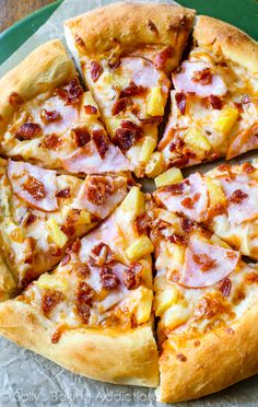 a pizza with pineapple and ham on it