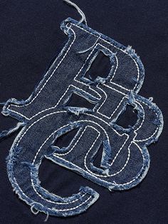 the letters b and g are made out of jeans