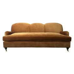 a brown couch sitting on top of a white floor