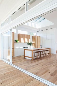 an instagramted photo of a kitchen and dining room