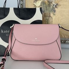 This Is Guaranteed 100% Authentic Kate Spade Bag Purchased At A Store In The Us With The Tag Attached. Buy With Confidence! Measurements 10.16" W X 7.2" H X 3.6" D Features Strap Drop: 22" Foil Embossed Logo Closure Type: Flap With Magnetic Snap Closure Dust Bag Included: No Interior: Back Zip And Front Slip Pockets Materials Pebbled Leather Lining: Two Way Script Logo Lining Imported Style Number Kc465 Tea Rose Color, Logo Line, Tea Rose, Script Logo, Tea Roses, Rose Color, Kate Spade Bag, Embossed Logo, Kate Spade Bags