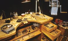 a workbench with tools and other items on it