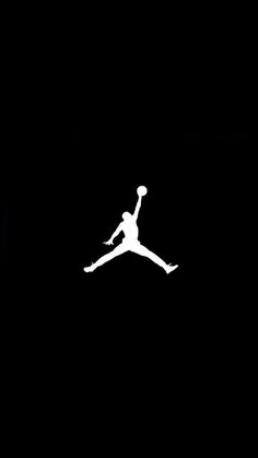 the silhouette of a person jumping up into the air with a basketball in their hand