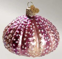 a pink ornament hanging from a string