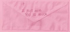 a pink envelope with the words i just miss you so much written on it