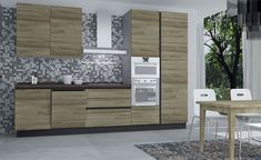 a modern kitchen with wood cabinets and white chairs