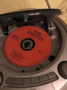 the smiths cd player with an orange disc