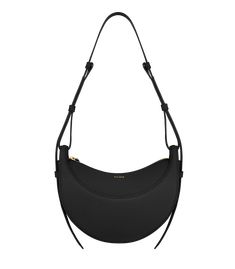 With its rounded shape, foam padding, and hand-stitching, the “Numéro Dix” is a nod to the equestrian codes of saddlery. Its half-moon design highlights juxtaposing curves. Black Leggings Outfit, Latest Handbags, Best Wallet, Moon Design, Black Textures, Black Bag, Black Canvas, Small Leather Goods, Outfits With Leggings