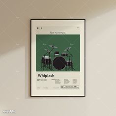 a poster hanging on the wall above a drum set