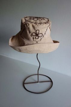 A stunning summer hand crochet cotton green and cream hat.    made entirely in mallorca spain by artisans.    this is a one size.    cold hand wash. Flower Eucalyptus, Cream Hat, Retro Nuptse Jacket, Furbish Studio, Sea Ny, Mallorca Spain, Bow Arrows, Boucle Jacket, Embroidered Hat