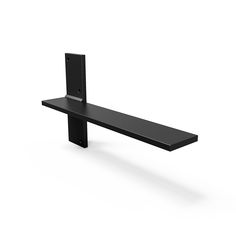 a long black shelf sitting on top of a white floor next to a phone holder