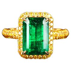 The Colour of the Emerald is mesmerizing and therefore we have selected the simplest possible setting so that people will focus in the Emerald instead of the ring. Yellow is well known in pairing with vivid green Emerald and we used yellow diamond pave set in yellow gold to further brings out the green in the Emerald. Main Emearld weight is 3.71ct Total Yellow Natural Diamond weight is 0.48ct US Ring Size is 7 1/2, The Inner Diameter of the Ring is 17.73 mm Amethyst Cocktail Ring, Yellow Diamond Ring, Boulder Opal Ring, Yellow Diamonds Engagement, Yellow Diamond Engagement Ring, Contemporary Engagement Rings, Yellow Sapphire Rings, Emerald Ring Gold, Yellow Diamond Rings