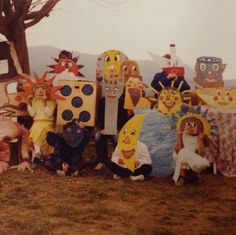 a group of people dressed up as spongebob and other characters sitting in front of a tree