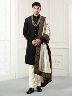 Featuring a Black quilted indowestern sherwani complemented with the georgette luckhnavi work shawl/dupatta with all over hand work on border.This is a designer piece that comes in process directly from our design house.Suitable for Indian Weddings, Bollywood parties and Indian Ceremonies, Perfect for Groom or Groomsmen.An ideal option to keep your persona composed & dignified for the wedding,sangeet event or a reception.Perfect for Groom or Groomsmen,family & friendsCOST INCLUDES SHERWA Sherwani For Men Wedding Indian Groom, Sherwani For Men Wedding Royals, Mens Wedding Wear Indian, Indowestern Sherwani, Sherwani For Men Wedding, Wedding Kurta For Men, Mens Wear Wedding, Groom Dress Men, Indian Groom Wear