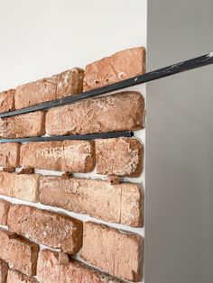 a wall made out of bricks and metal bars