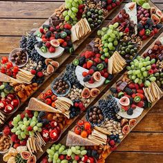 an assortment of cheeses, fruits and crackers arranged in the shape of a number