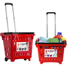 two red shopping baskets with wheels and labels on the handles, one is full of cleaning supplies