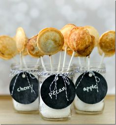 small jars filled with different types of appetizers