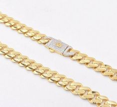 9mm Miami Cuban Royal Link Chain Necklace CZ Box Clasp Real 10K Yellow Gold• Metal : Real 10K Yellow Gold (Properly Stamped, 10K)• Condition : Brand New• Finish : Polished• Avg Weight : 32.00 grams (24" version)  --- 1.33 grams/per inch• Length : Selectable• Width : 3/8" = 9mm• Clasp/Bail : CZ Box LockAll of our items are brand new and are shipped with a gift box. Luxury Cuban Link Round Necklace Formal, Gold Cuban Link Necklace With Diamond Accents, Gold Diamond Cuban Link Necklace Gift, Gold Diamond Cuban Link Necklace For Formal Occasions, Luxury Cuban Link Necklace With Diamond Cut As Gift, Gold Diamond Cuban Link Necklace As Gift, Gold Cuban Link Necklace Diamond Cut Gift, Gold Cuban Link Necklace With Diamond Cut, Luxury Gold Cuban Link Necklace With Diamond Accents