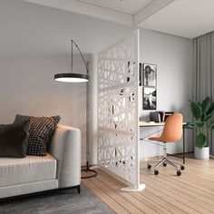 a living room with a couch, chair and desk