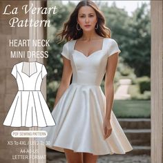 a woman in a short white dress with the text la verart pattern heart neck mini dress