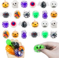 a hand holding an assortment of halloween candies with eyes and mouth shapes on them