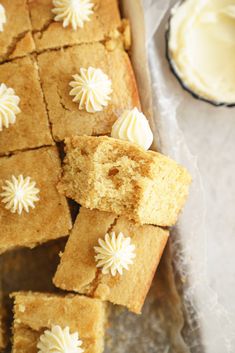 several pieces of cake with white frosting on top