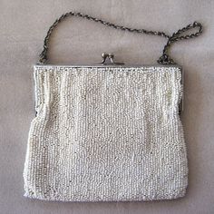 "Want something old and unique for your wedding? This lovely handbag is beaded in white and embroidered in delicate shades of yellow, green, grey and pink. Silver-tone frame, little silver chain. Interior is cream silk with a pocket. It comes with the original silk-framed mirror and a little plastic comb. Large enough to hold those bridal essentials. The interior is a bit soiled - not horrible by any means, considering this bag's age. The beading is intact. Measures 5\" x 4 1/2\"." Bridal Essentials, Gold Chain Link Necklace, European Cut Diamond Ring, Art Deco Pink, Framed Mirror, Great Falls, Cream Silk, Something Old, European Cut Diamonds