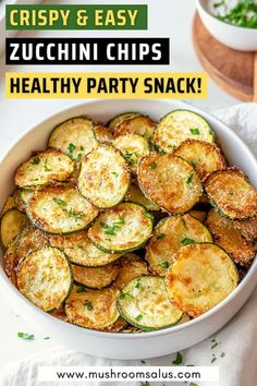 zucchini chips in a white bowl with text overlay that reads crispy & easy zucchini chips healthy party snack