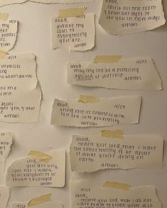 several pieces of torn paper with words on them and some type of adhesive stickers attached to the wall