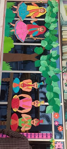 an image of paper cutouts on the side of a building with trees and flowers