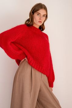 "The Relaxed Mohair Sweater is skillfully hand knitted in our premium Italian mohair blend. Lightweight yet super warm, it is the perfect cozy layer for winter. Designed for a relaxed fit, this sweater is so flattering and comfortable, you'll never want to take it off. It has an oversized and slightly cropped shape with a classic mock neck and raglan sleeves. Handcrafted in Greece. DETAILS * Super soft, premium quality Italian mohair * Composition: 60% kid mohair, 40% microfiber * Hand wash in c Red Mohair Sweater, Casual Red Mohair Sweater, Red Chunky Knit Turtleneck Sweater, Red Oversized Knitted Sweater, Oversized Red Knitted Sweater, Oversized Crew Neck Knitting Pattern, Oversized Crew Neck Hand Knitted Pattern, Red Knitted Sweater For Fall, Red Knitted Sweater Outfit