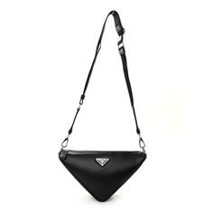 This is an authentic PRADA Calfskin Triangle Shoulder Bag in Black. This stylish bag is crafted of black calfskin leather in a triangle structure. The bag features silver hardware and black nylon shoulder strap. The top unzips to a black fabric interior with a pocket. 1424461 Chic Everyday Triangle Shoulder Bag, Prada Triangle, Luxury Triangle Bag With Detachable Handle, Triangle Prada Bag, Prada Black Leather Shoulder Bag, Prada Nylon, Triangle Bra, Black Nylons, Stylish Bag