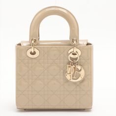 Make a statement with this previously loved Dior Lady Dior Small Cannage Patent Calfskin Beige Bag. This sophisticated handbag showcases a timeless quilted design and a chic beige patent leather finish. Add this luxurious second-hand accessory to your collection now! Wallet Chains, Hand Accessories, Beige Bag, Leather Finish, Handbag Wallet, Wallet Accessories, Casual Backpack, Lady Dior, New Bag