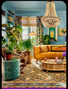 a living room filled with furniture and lots of plants