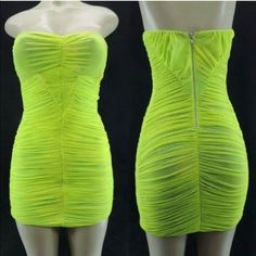 a mannequin is wearing a neon green dress