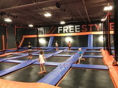 children playing on an indoor trampoline course at the free style trampoline