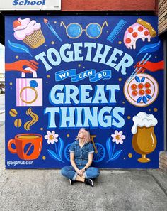 a woman sitting in front of a sign that says together we can do great things