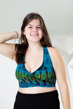 We took one of our favorite tops evenfurther into the psychedelic colorful explosion of hippie fashion.The perfect top for athletic or casual endeavors, it can be wornas an undergarment ora boho bralette, as a supportive garment when exercising, as a swimsuit top, or allon its own as a cuteboho statement top. Tied in the front, or tied around back, it doesn't matter as it is all groovy as long as it's Tie Dye. Yoga Wrap Top, Colorful Explosion, Stretchy Crop Tops, Hippie Fashion, Tie Dye Designs, Purple Teal, Doesn't Matter, Swimsuit Tops, Wrap Top