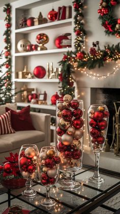 a living room decorated for christmas with red and gold ornaments