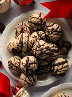 a white plate topped with cookies covered in chocolate