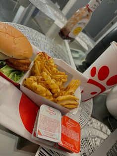 a hamburger and french fries are sitting on a table