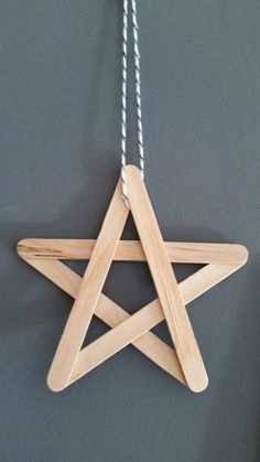 a wooden star hanging on a wall